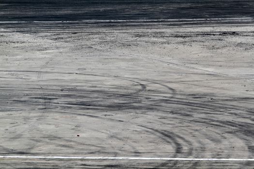 Background with tire marks on road track