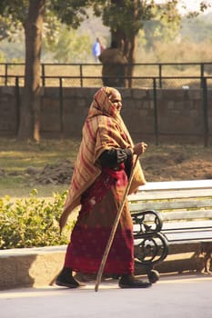 Indian woman walking in the streets of New Delhi, India