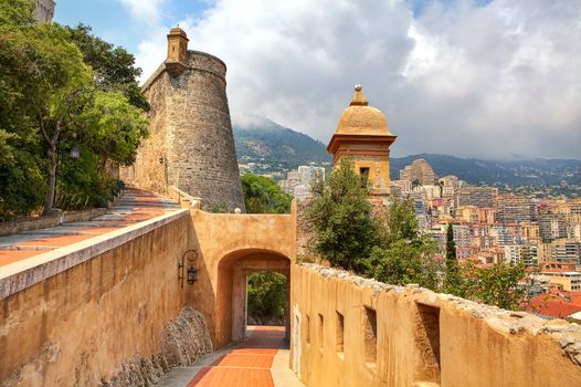 View of medieval fortifications and modern residential buildings on background in Monte Carlo, Principality of Monaco.