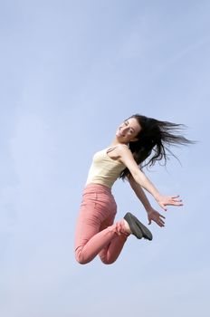 happy smiling woman doing joyful leap