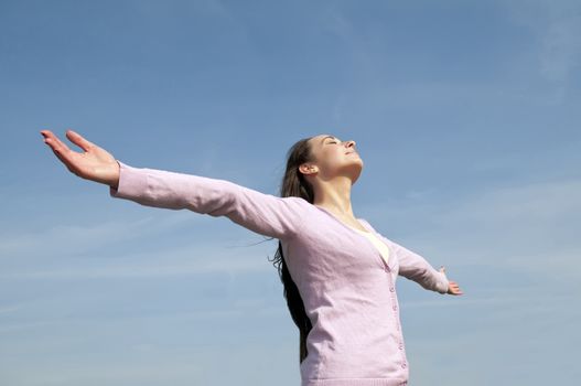 woman feeling free with arms wide open