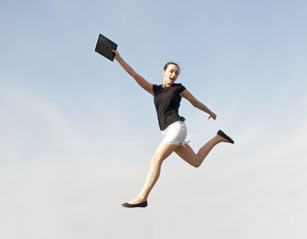  happy business woman jumping with digital tablet