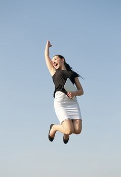  happy business woman jumping with digital tablet
