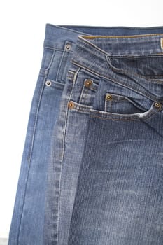 Close up image of denim jeans pocket with a ripped hole