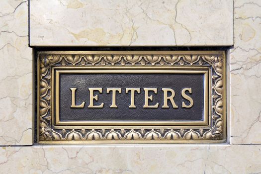 Old Antique Letter Mail Box in Marble Wall