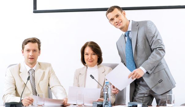 group of business people discussing documents, teamwork