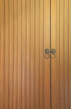 Old vintage wooden door with metal handle