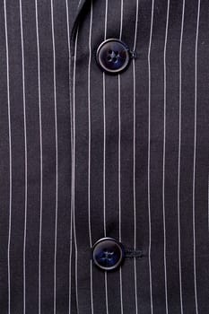 Black and white pinstripe suit detail up close