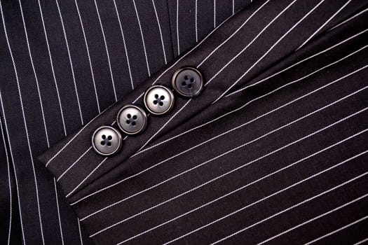 Black and white pinstripe suit detail up close