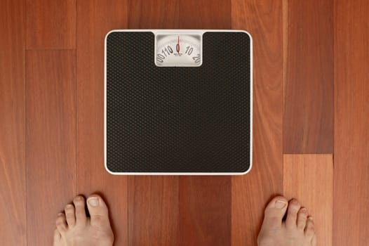 Bathroom scales isolated against a white background