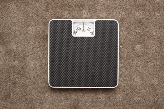 Bathroom scales isolated against a white background