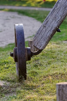 Old wagon wheels on a wooden column