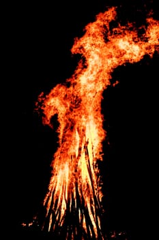 red flames of huge bonfire or campfire as black backgorund