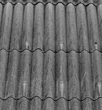 monochrome texture of gray corrugated slate roof