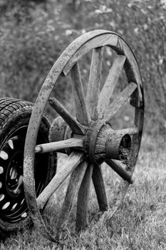 new and old broken wagon (car) wheel