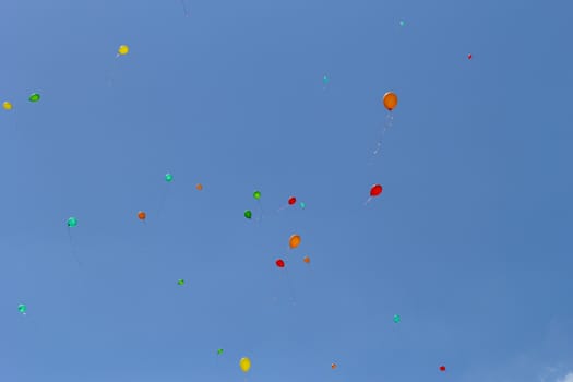 color balloons flying to the sky