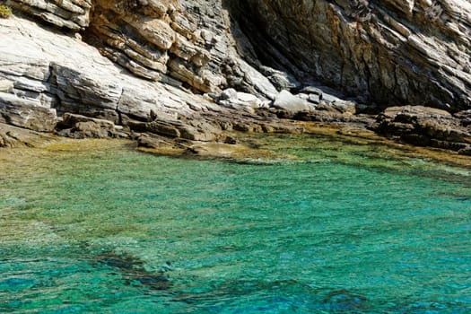 rocky beach with turquoise sea in greece thassos island