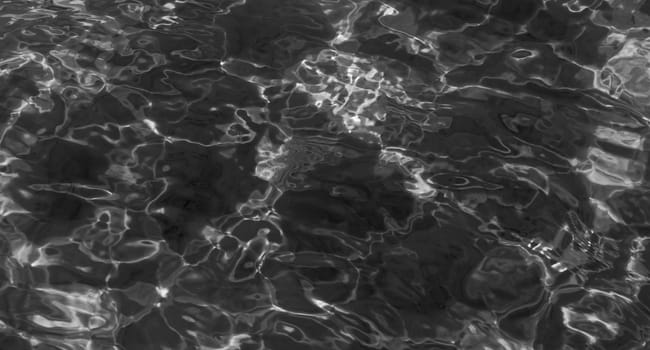 grey abstract background of wavy water surface