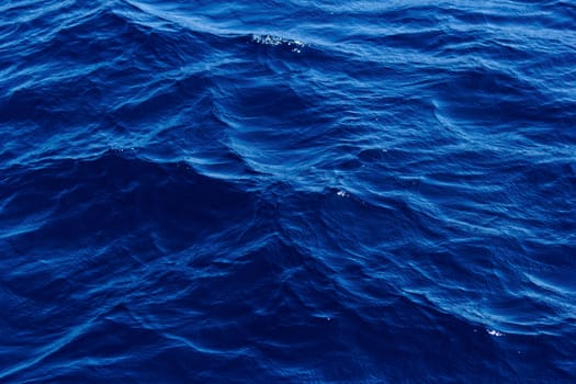 blue abstract background of wavy water surface