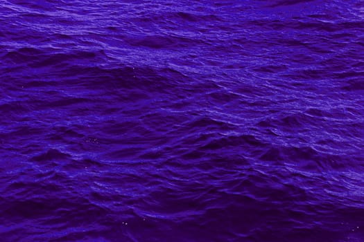 purple abstract background of wavy water surface (lilac)