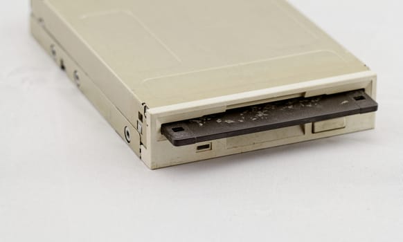 Floppy disk drive and diskette on white background