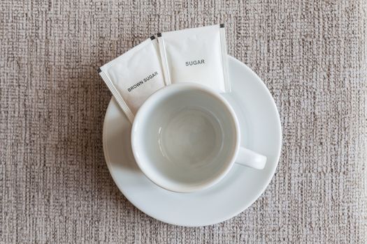 empty coffee cup and sugar