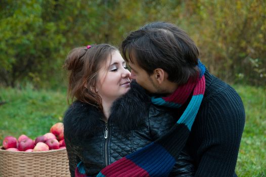 young couple embracing in autumn nature