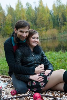 Beautiful loving couple in the Park in autumn picnic