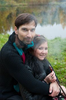 Beautiful loving couple in the Park in autumn picnic