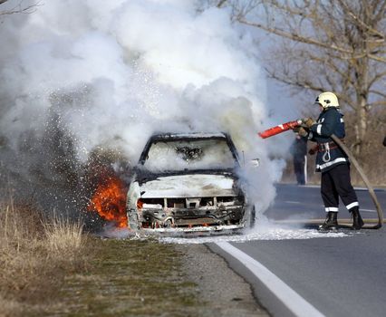 burning car on the road