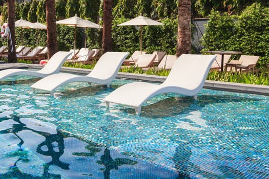 chaise lounge or chair in swimming pool
