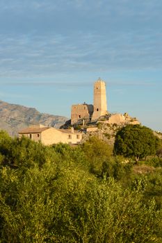 Penella castle ruin in eastern Spain surrounded by Mediterranean landscape