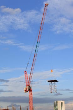 Construction site with crane worker and building