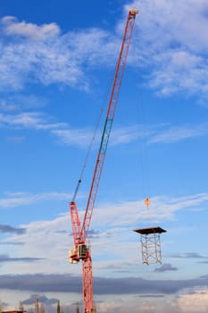 Construction site with crane worker and building