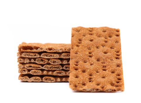 Stack of whole grain crisp bread isolated on a white background