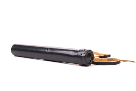 Black cover of spyglass lying on a white background