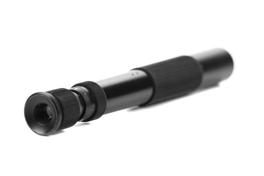 Black spyglass lying on a white background