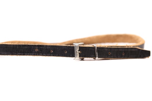 Black leather belt with a rectangular buckle isolated on white background