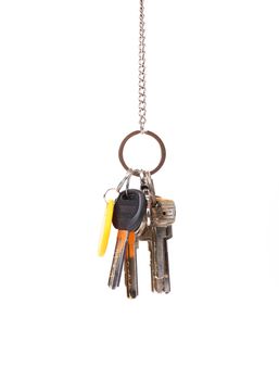 Bunsh of keys hanging on a chain. White background.