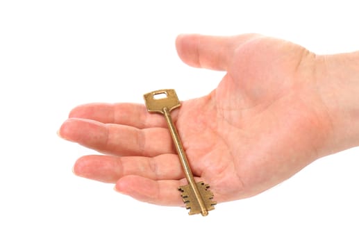 Hand holds bronze steel key. White background.
