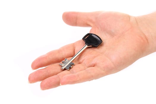 Hand holds modern steel-plastic key. White background.