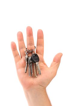 Bunch of keys are on a hand. White background.