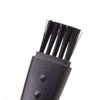 Black plastic brush. Close up. White background.