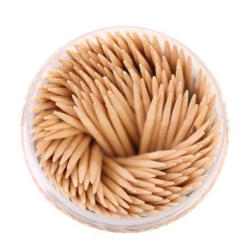 toothpicks in a round box, top view, isolated on white background.