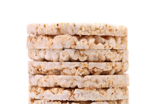 Stack of corn crackers. Close up. White background.