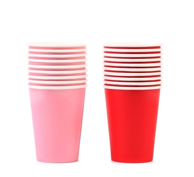 Pile of colorful paper coffee cup. Close up. White background.