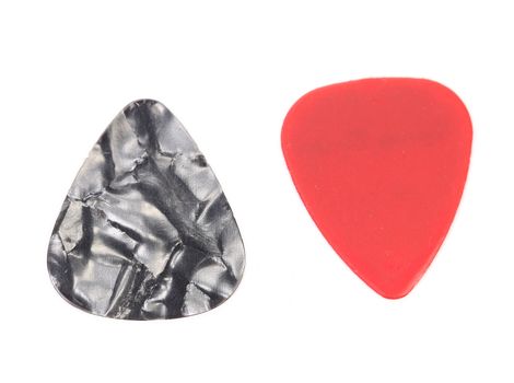 Red and dark plastic guitar plectrums, isolated on white