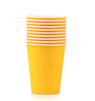 Pile of colorful paper coffee cup. Close up. White background.