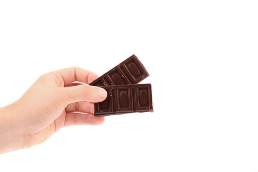 Hand holds chocolate bars. Isolated on a white background.