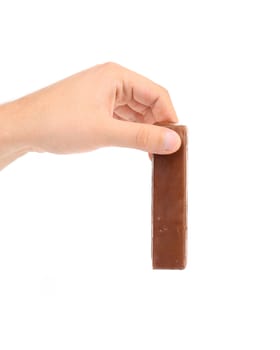 Hand hold chocolate bar. Isolated on a white background.